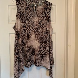 Jennifer Lopez black and tan sleeveless top.